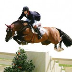 Britain's Skelton riding Arko III clears a fence in the first round of showjumping in the Athens 2004 Olympic Games